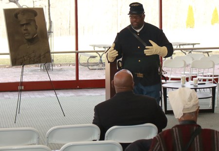 An african american ranger portrays a Buffalo Soldier during an event