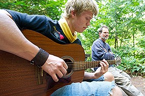 A man plays guitar