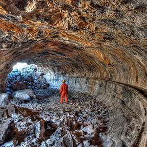 Caver in large lava tube