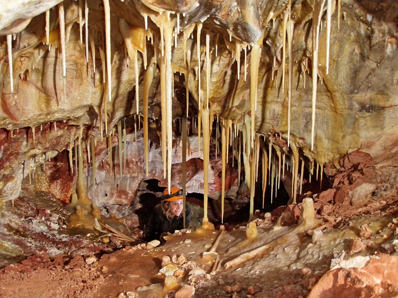 a person exploring cave formations