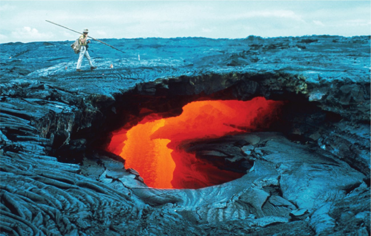 a person walking on hardened lava surface with molten lava visible through a large hole
