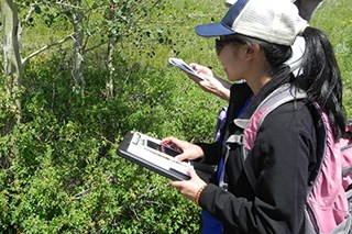 Rocky Mountain National Park Youth take notes on a pad of paper