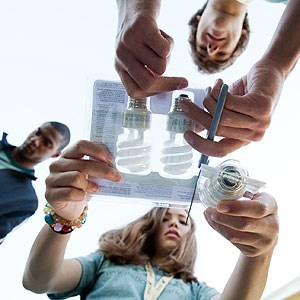 Students learn about compact fluorescent light bulbs Students learn about compact fluorescent light bulbs