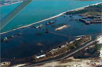 A picture taken from an airplane that shows flooding across a town