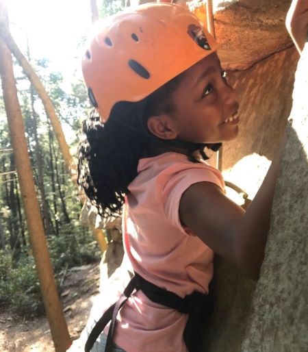 Female child tries climbing for the first time at Obed Wild and Scenic River