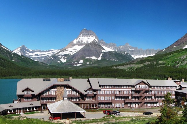 hotel on a lake at the foot of mountains