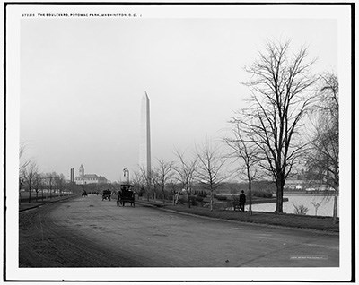 400_4a23934v _ Boulevard of Potomac Park _1910 Horse-drawn carriages travel an unpaved road, bordered by trees and water