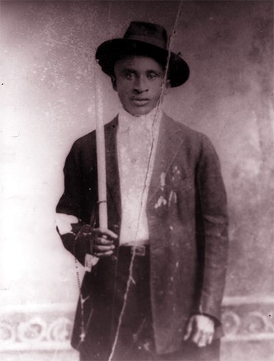Amédé Ardoin in brimmed hat and jacket, in 1912