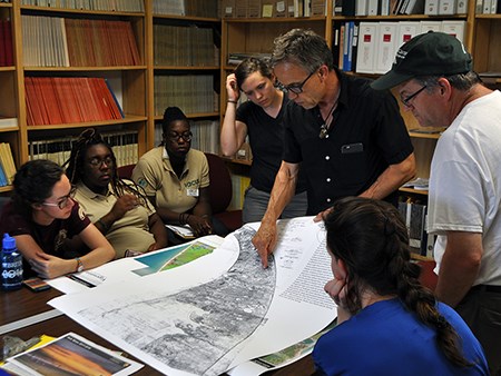 The 2017 Designing the Parks group learns about the documentary history of Cape Cod through maps with park staff.