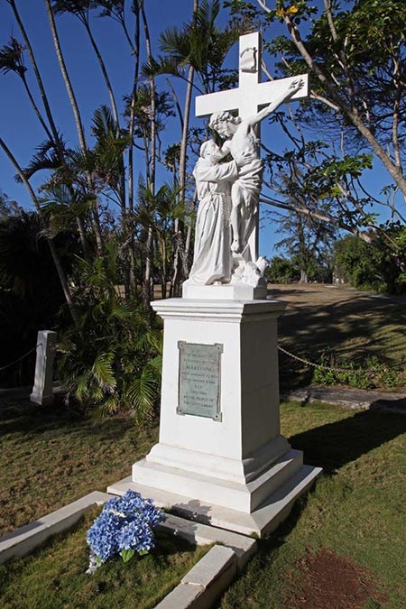 A concrete monument depicts Christ coming down from the cross to embrace St. Francis.