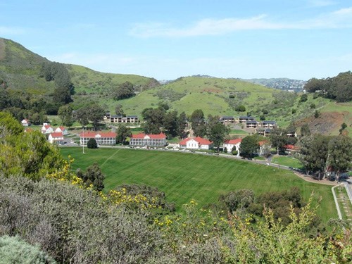 A wide view of the Fort Baker Parade Ground shows its lush green revival.