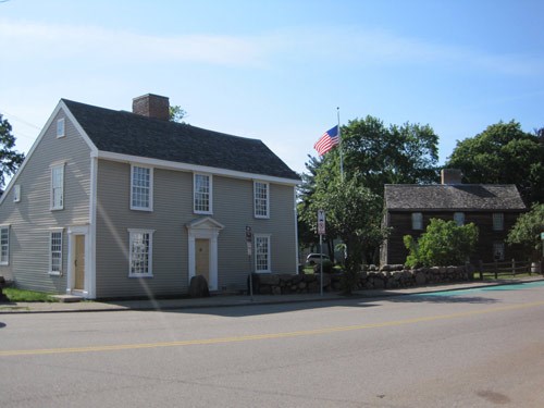 A contemporary photo of the two houses that are the Adams Birthplaces.