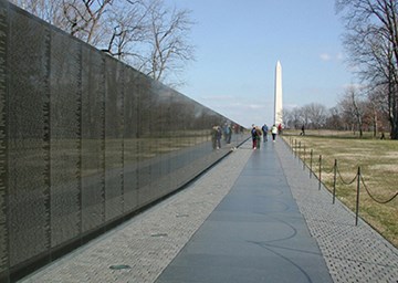 From the Vietnam Veterans Memorial, the Washington Monument is seen rising over the west knoll of Constitution Gardens.