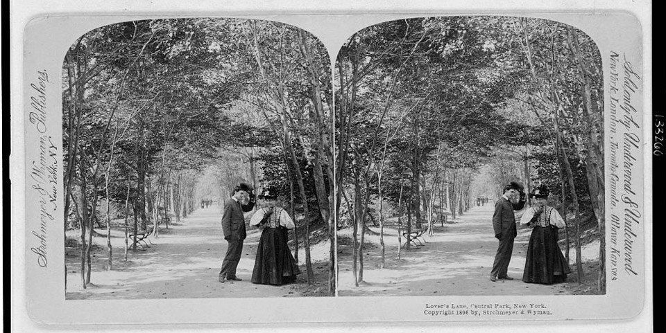 Stereoscopic photo shows side-by-side images of a man tipping his hat to a woman on the edge of a wooded pathway.