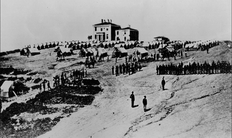 Camp Hill, 1862 Troops stationed at the armory superintendent's house in 1862, showing a bare and compacted earth.