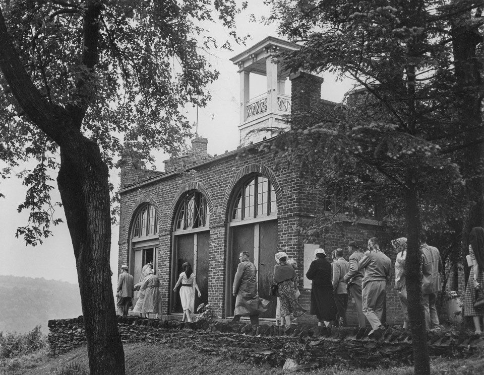 lt= Visitors to Harpers Ferry NHP take a tour of John Browns Fort.