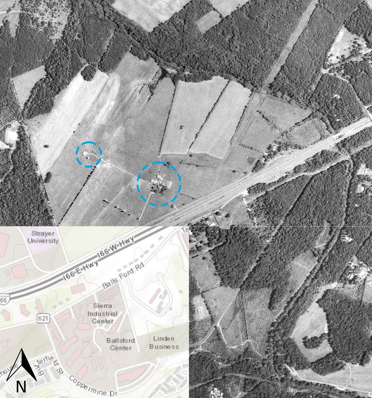 A black and white aerial photograph showing agricultural fields, roads, streams, and a building cluster.