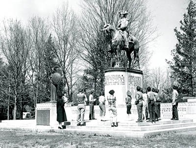 Nathanael Greene Statue, 1958 Visitors stand in front of the Nathanael Greene Statue, a man atop a horse on top of a monument base