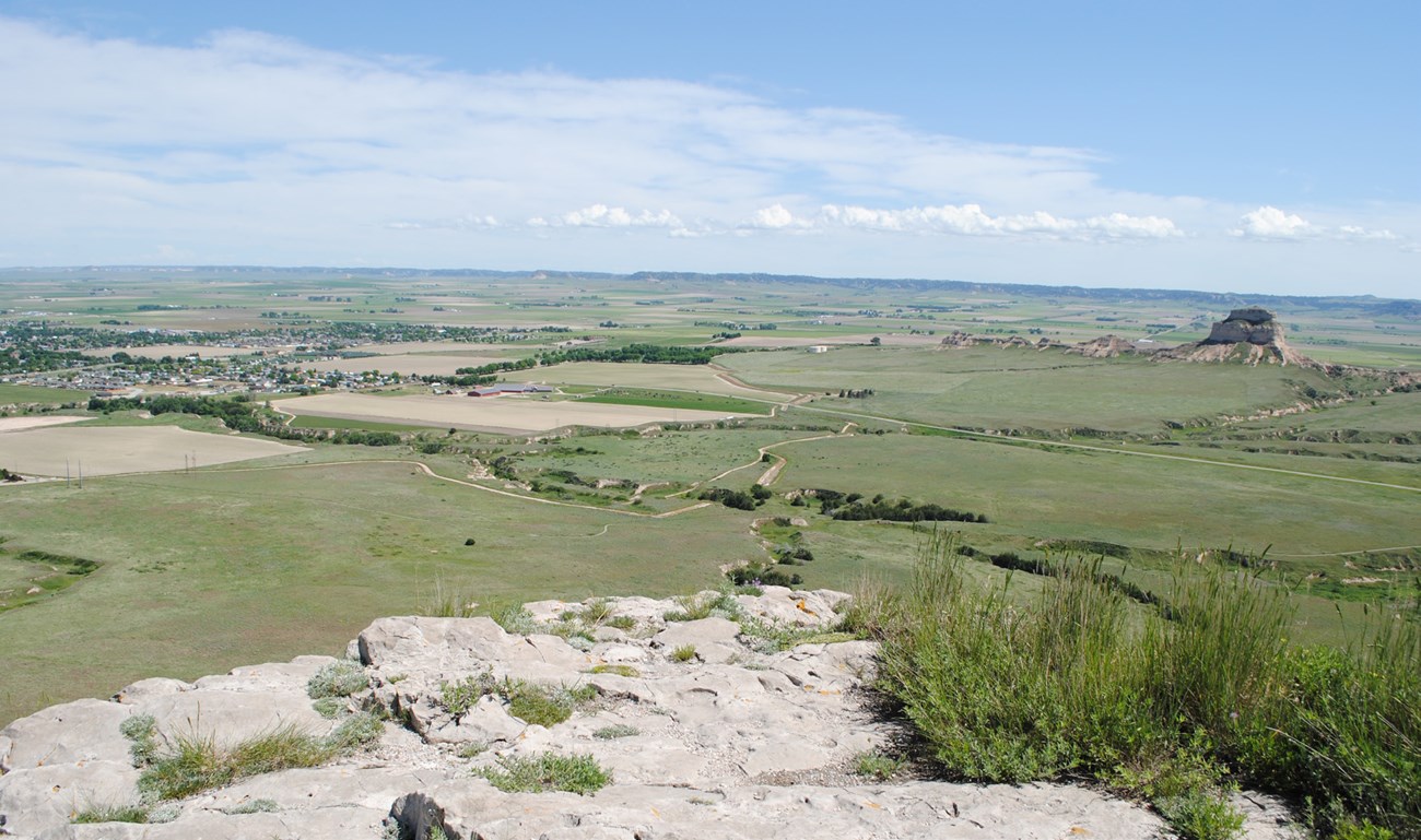 View from high point at Dome Rock includes the rocky prominence of Scotts Bluff rising above flat plains
