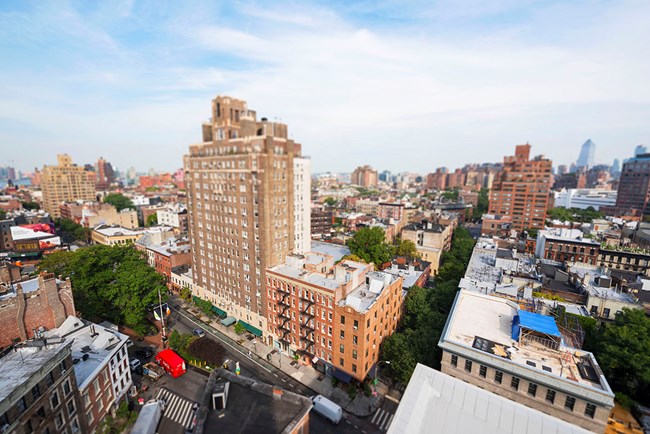 High angle view of the Stonewall National Monument includes the city park, streets, and buildings of Greenwich Village.