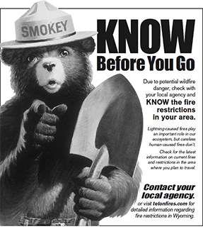 Ad with Smokey Bear and message Know BEFORE You Go.