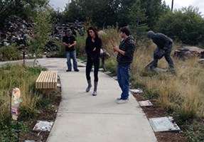 Students look at the memorial stones in the monument.