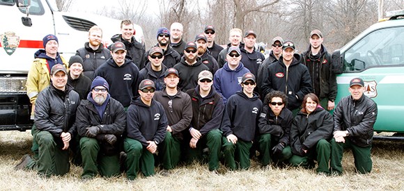 The Midewin Hotshots and the Indiana Dunes fire staff group up for a photo.