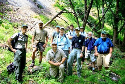 CHOH PALEO PROTECTORS group of people gathered together in wooded area