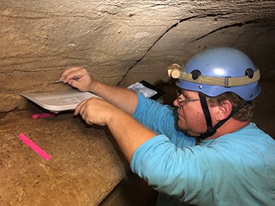 IMG-4308 person working in a cave