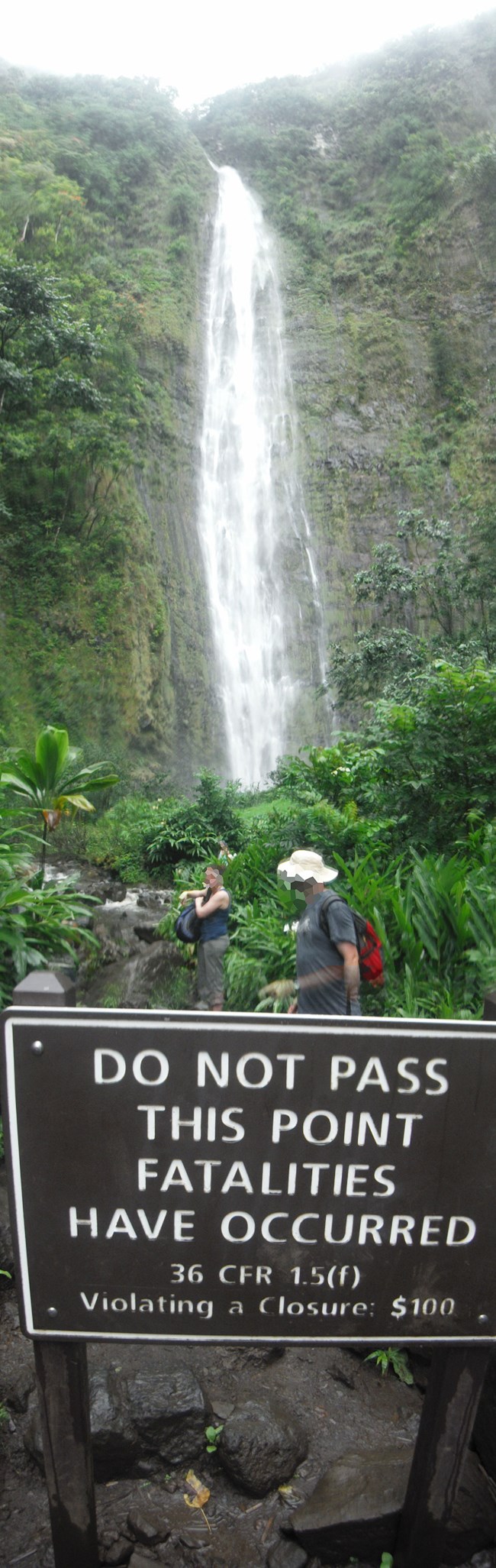 waterfall and warning sign
