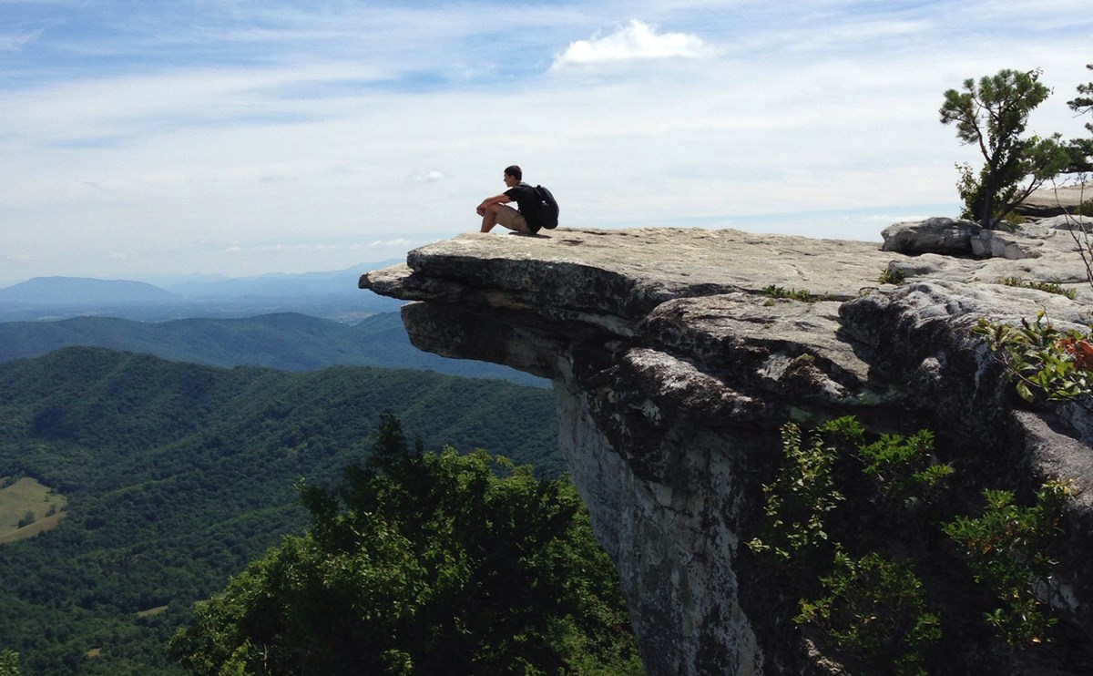 person on rock overlook person on rock overlook
