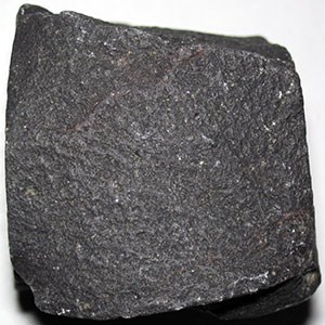 Photo of a dark fine-grained rock.