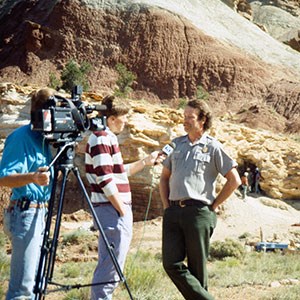 A film crew interviews a park ranger for a documentary at Capitol Reef NM.