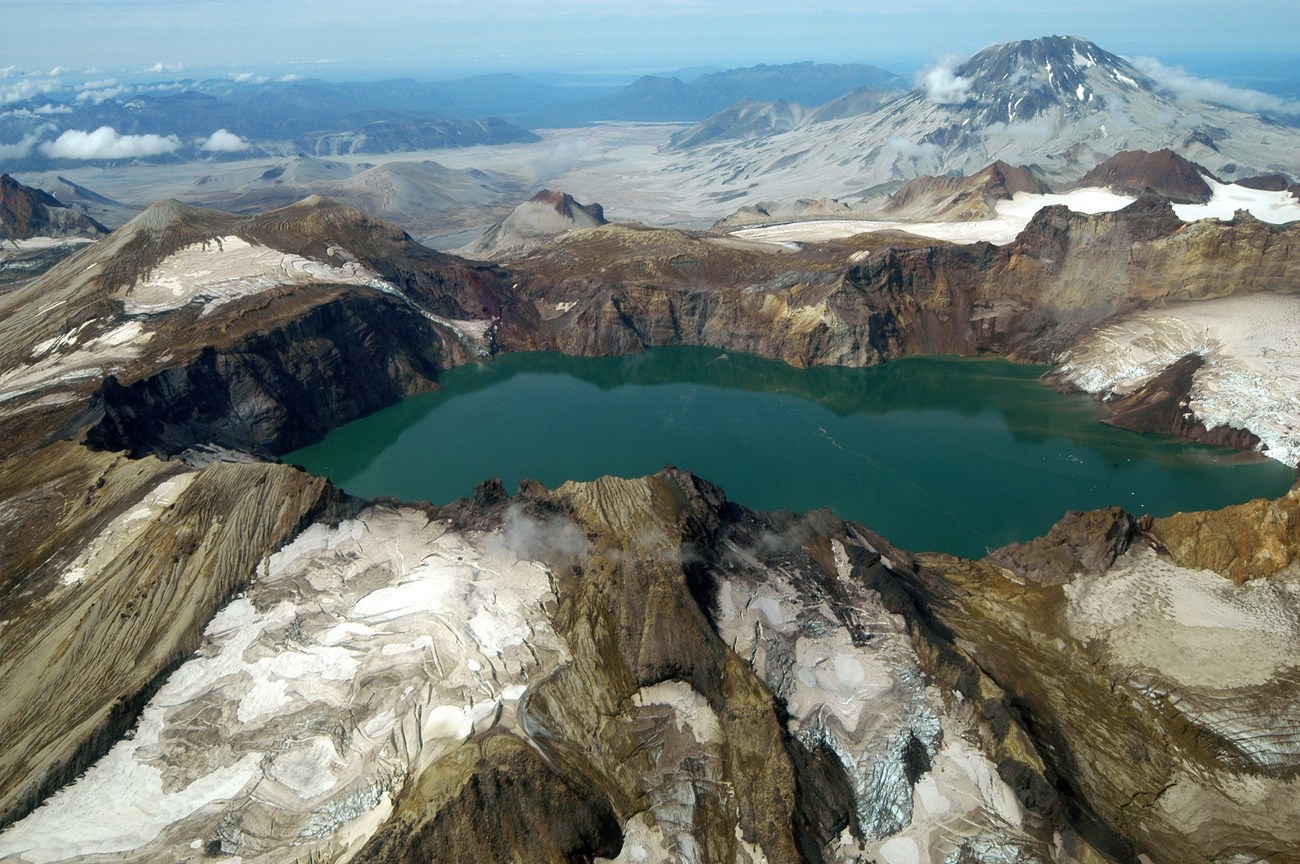 volcanic landscape with glaciers and caldera lake