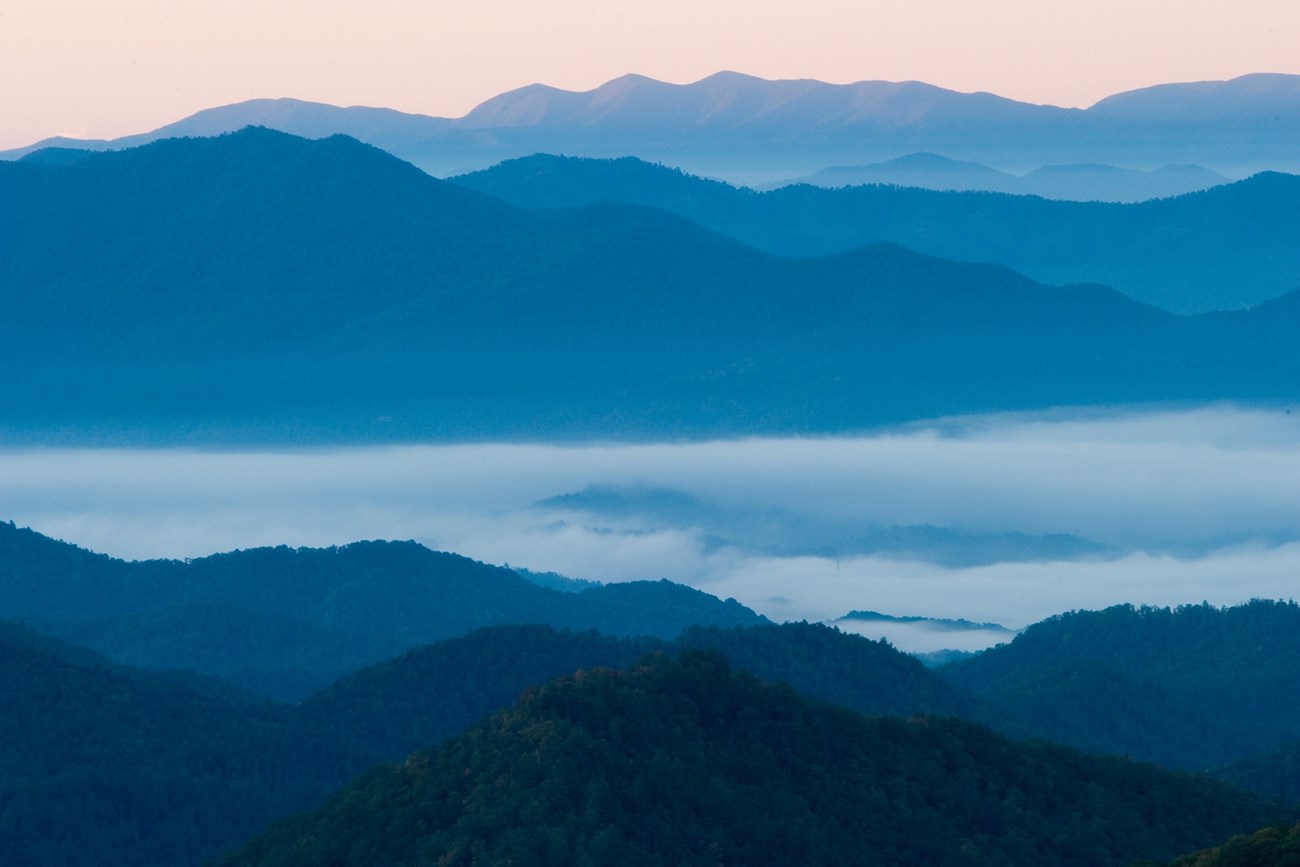 blri photo of mountain ranges and cloud filled valleys