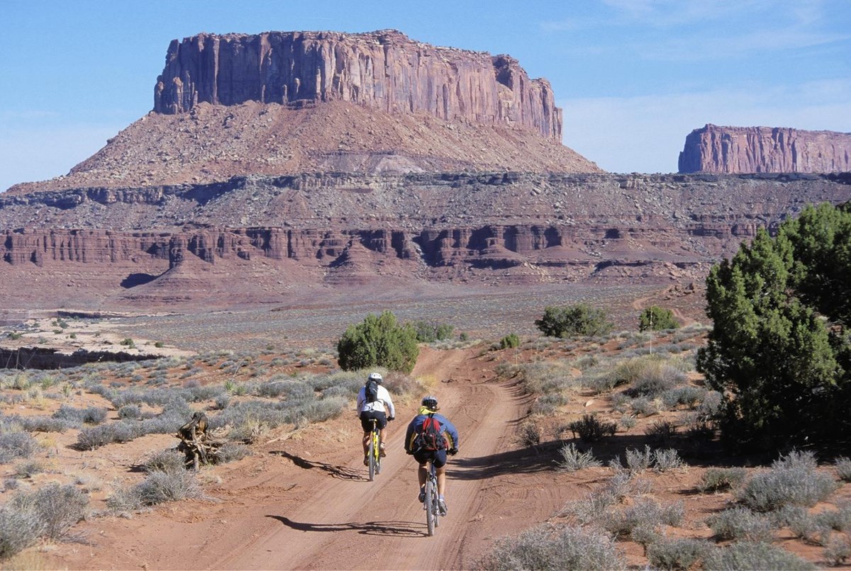 sedimentary rock layers and bicycle riders