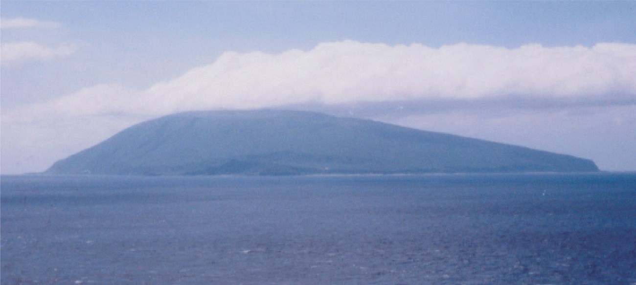 ocean with an island in the distance