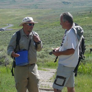 two people talking outdoors