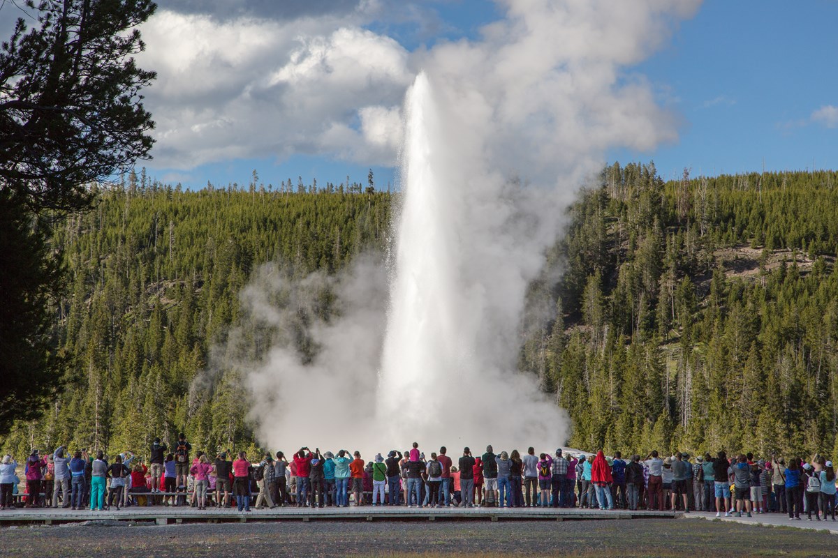 crowd of people at old faithful geyser