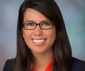 Learn more about panelist, Maria Givens. woman in glasses poses for picture