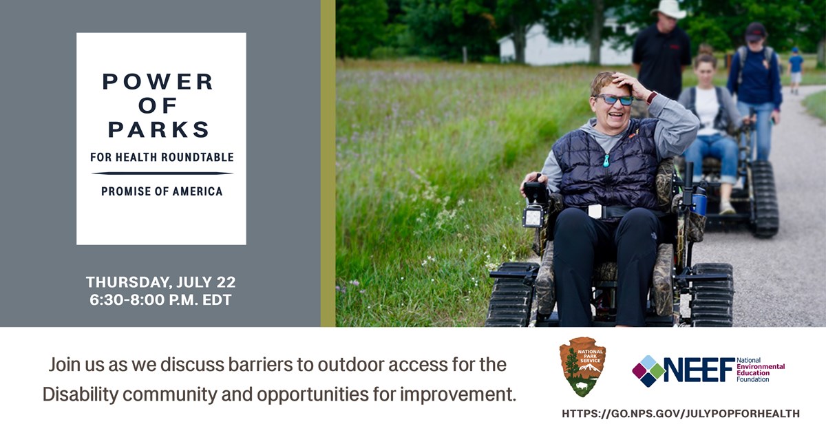 visitor uses trail accessible wheelchair to enjoy nature