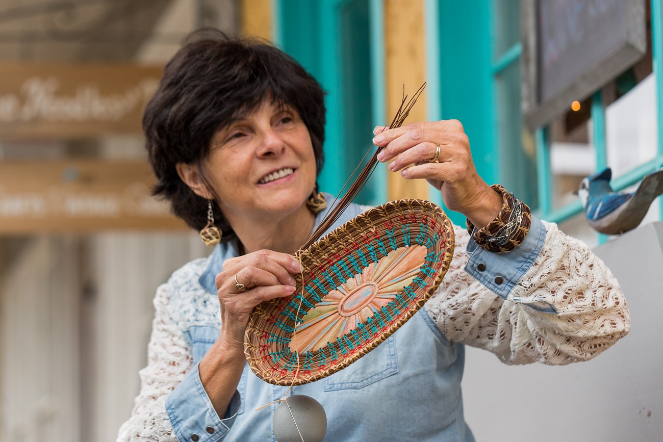 Carmen Haynes of Pine Needles and Things weaves a pine needle basket in the Blue Ridge NHA