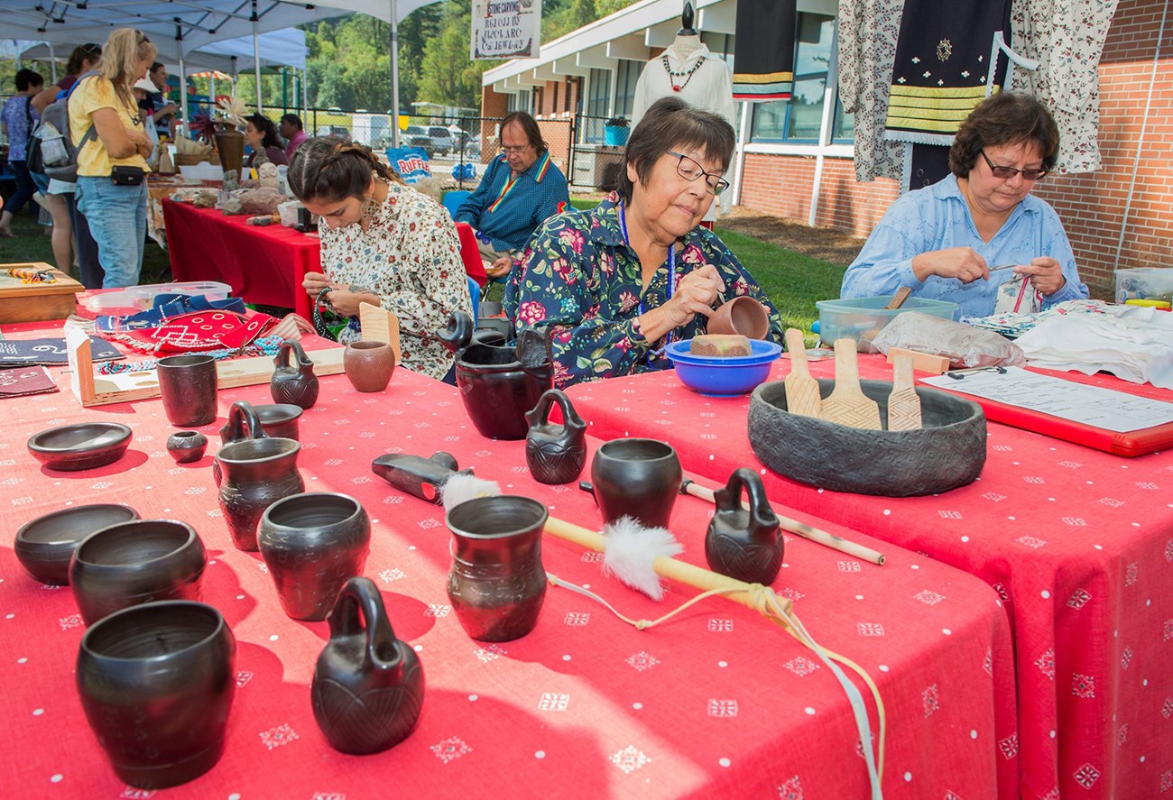 Cherokee women work on pottery and other crafts at Mountain Heritage Day in the Blue Ridge NHA