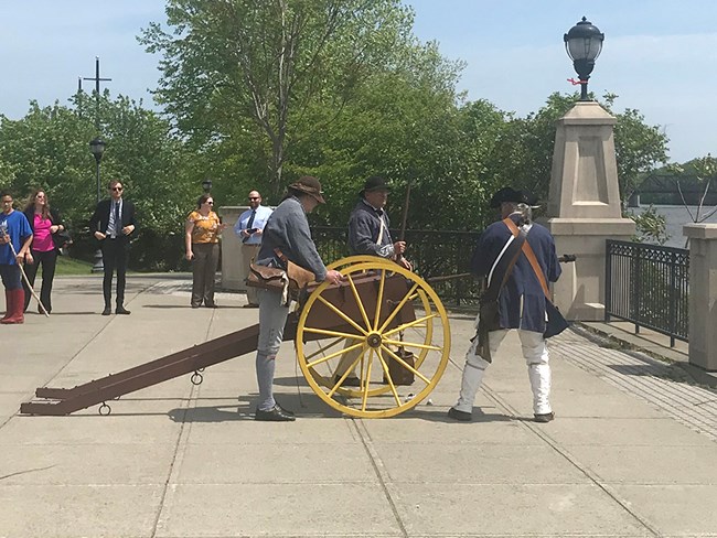 Firing a Cannon at Henry Knox Cannon Trail Unveiling Historical reenactors from Schuyler’s 2nd Regiment prepare to fire a cannon
