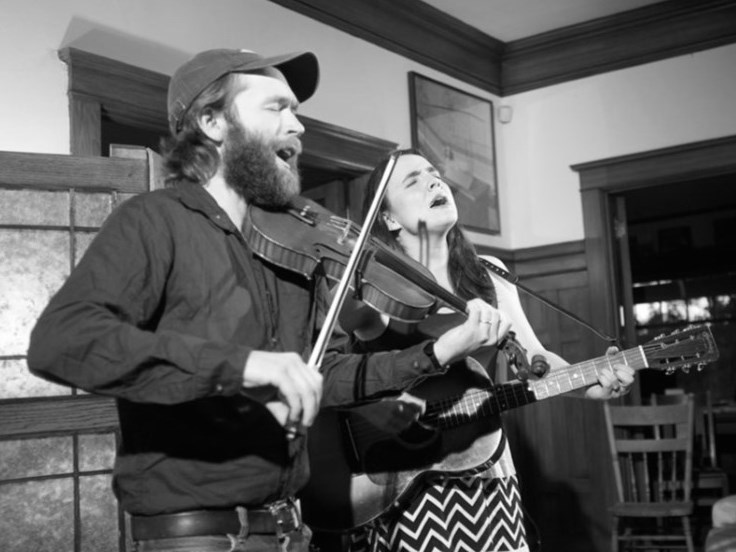 Old-time musicians Jesse Milnes and Emily Miller play fiddle and guitar