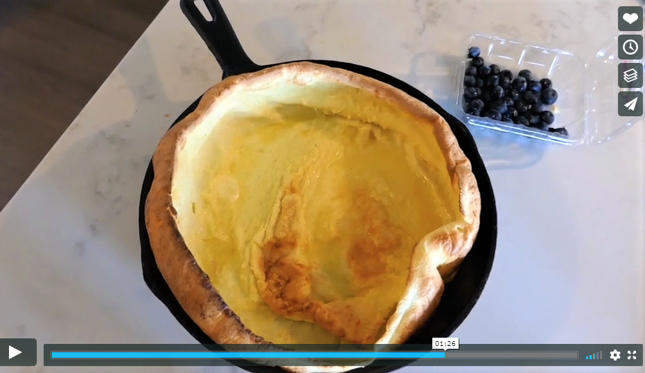 A screenshot of a german pancake in a cast iron pan