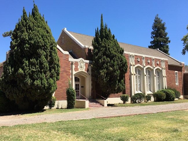 Jean Harvie Community Center (Walnut Grove, CA), a brown brick building with large windows