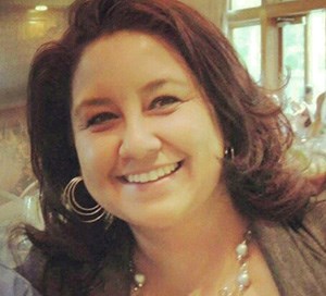Interim Executive Director Julie Chacon of Sangre de Cristo NHA Headshot of a smiling woman