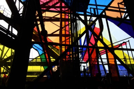 Sheets of colorful plastic are installed between the rusted metal beams of the Carrie Blast Furnaces in 2015 for Oreen Cohen’s art work.