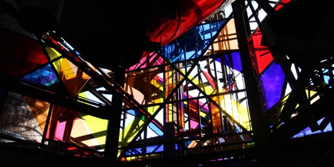 Fake stained glass and rusted metal beams make up the art installation “Spectre and Shade,” by Oreen Cohen, at the Carrie Blast Furnaces’ Alloy Pittsburgh art exhibit in 2015.
